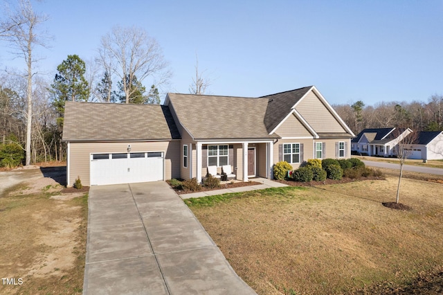 view of front facade with a front yard, an attached garage, driveway, and roof with shingles