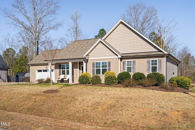 ranch-style home with an attached garage and a front lawn