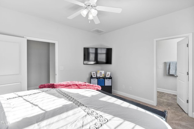 carpeted bedroom featuring visible vents, baseboards, and ceiling fan