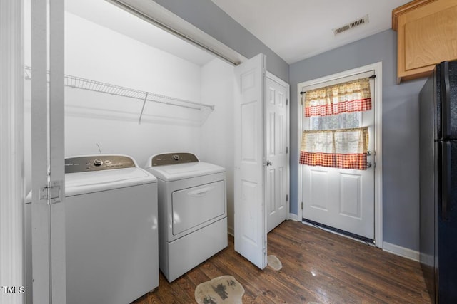 laundry area featuring baseboards, visible vents, laundry area, separate washer and dryer, and dark wood-type flooring