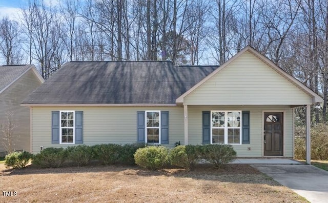 view of front of home with a shingled roof