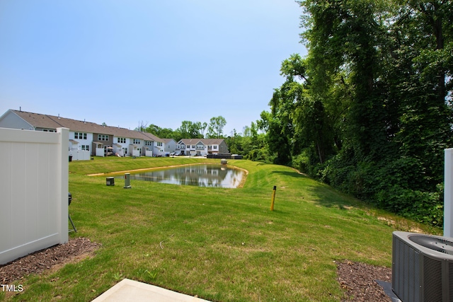 97 Begonia St, Angier, NC 27501 - view of grassy yard featuring cooling unit, a water view, and a residential view