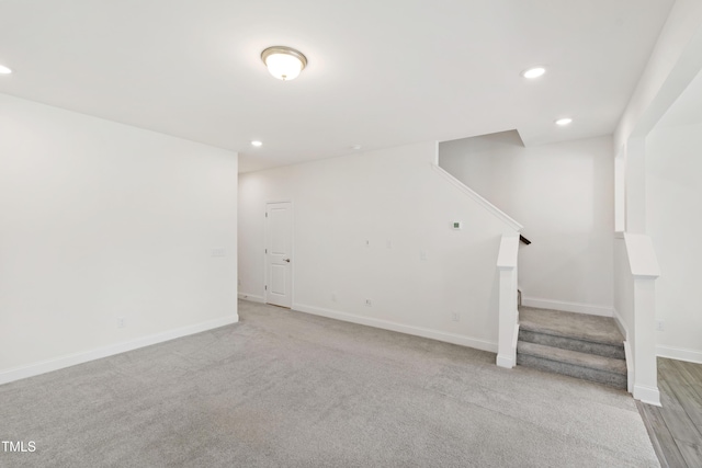 97 Begonia St, Angier, NC 27501 - below grade area featuring stairs, recessed lighting, baseboards, and light colored carpet