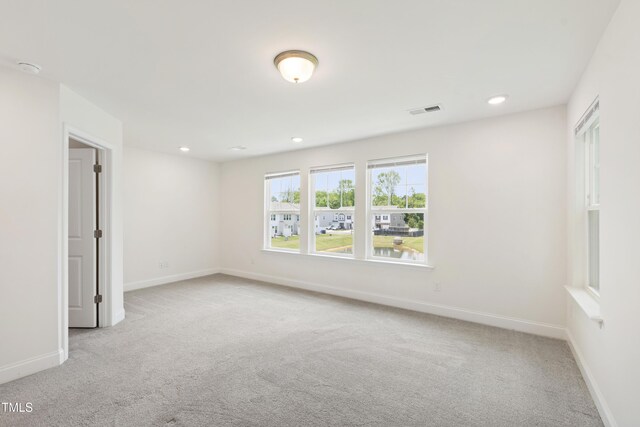 97 Begonia St, Angier, NC 27501 - carpeted spare room with baseboards and recessed lighting