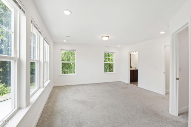 97 Begonia St, Angier, NC 27501 - empty room featuring light carpet, recessed lighting, and baseboards