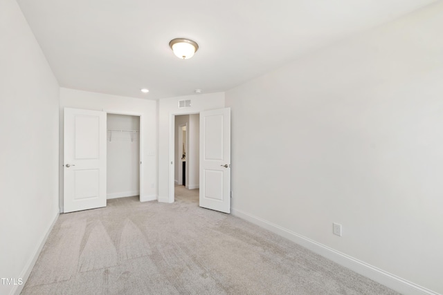 97 Begonia St, Angier, NC 27501 - unfurnished bedroom featuring baseboards, carpet, and a closet