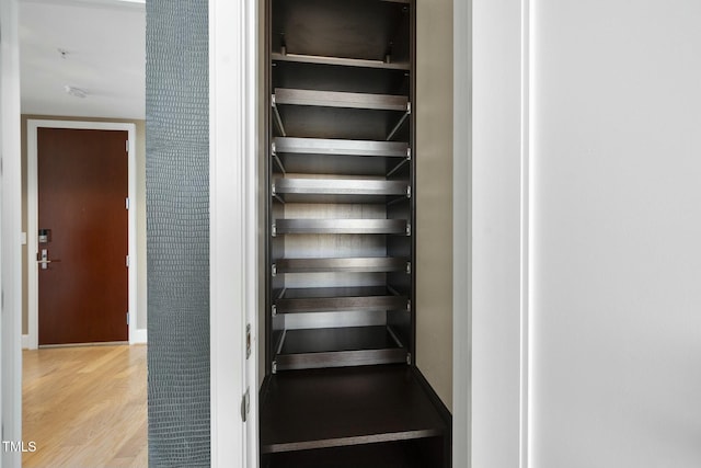 stairway with wood finished floors