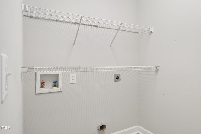 washroom with laundry area, hookup for an electric dryer, baseboards, and washer hookup