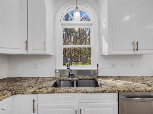 kitchen with dishwasher, a wealth of natural light, white cabinetry, and a sink