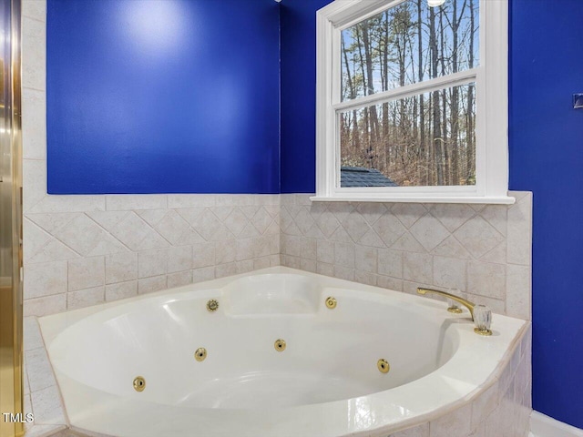 full bathroom with a jetted tub