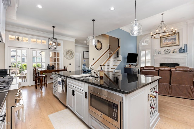 12500 Richmond Run Dr, Raleigh, NC 27614 - kitchen featuring stainless steel appliances, a sink, a chandelier, recessed lighting, and light wood-type flooring
