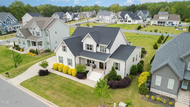 birds eye view of property with a residential view