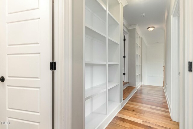 corridor with light wood finished floors