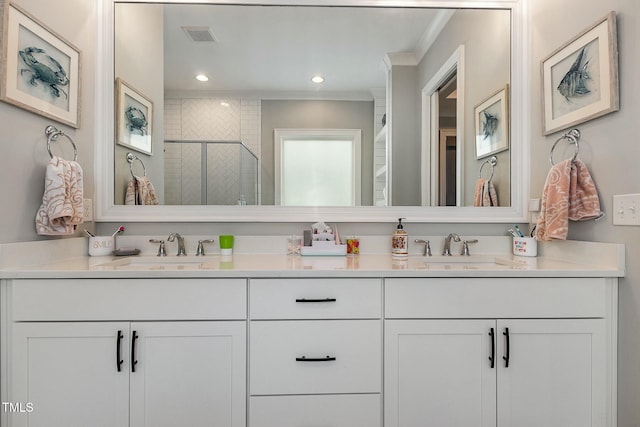 full bath with double vanity, visible vents, a stall shower, and a sink