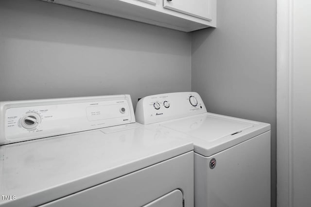 laundry room with washer and dryer and cabinet space