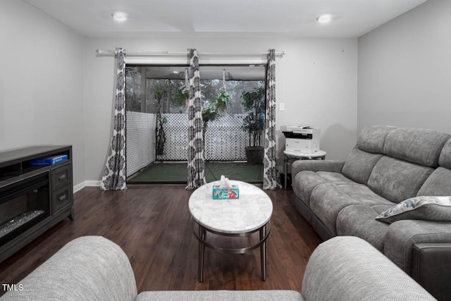 living area featuring wood finished floors and baseboards