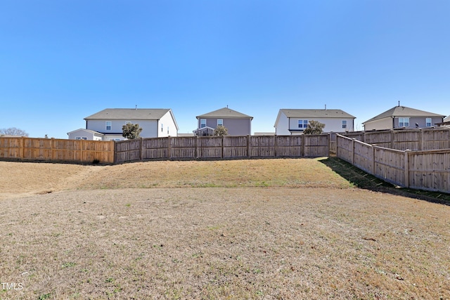 view of yard with a fenced backyard