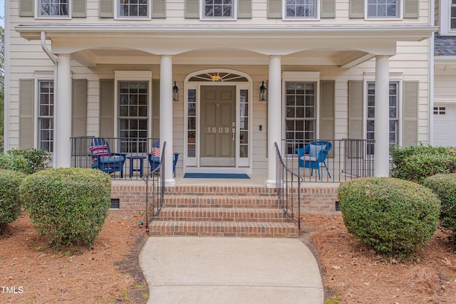 property entrance with covered porch