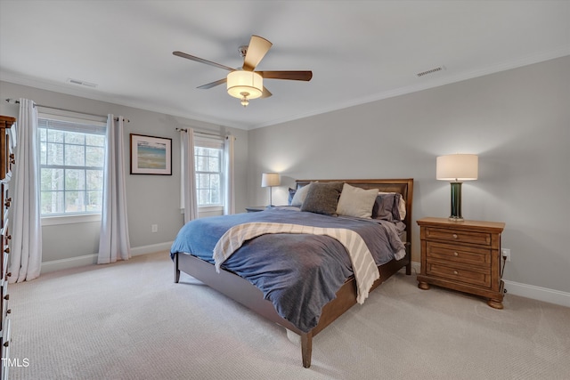 bedroom featuring visible vents, light colored carpet, and crown molding