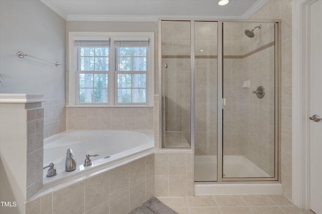 full bathroom featuring a stall shower, a garden tub, ornamental molding, and tile patterned floors