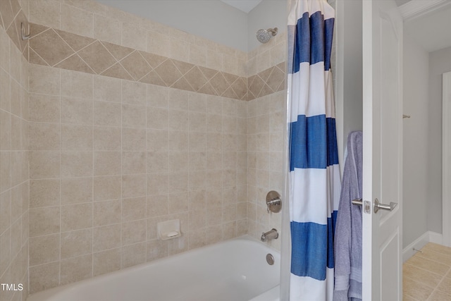 full bathroom featuring tile patterned floors and shower / bathtub combination with curtain