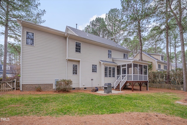 rear view of house with crawl space, fence, a patio, and a sunroom