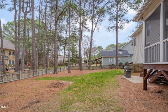 view of yard featuring a patio and a fenced backyard