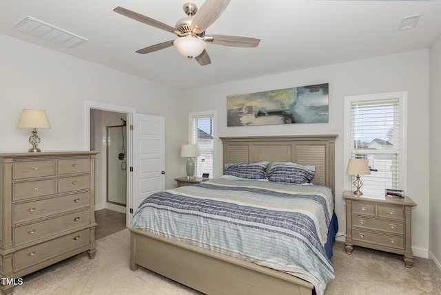 bedroom with visible vents, multiple windows, and light colored carpet