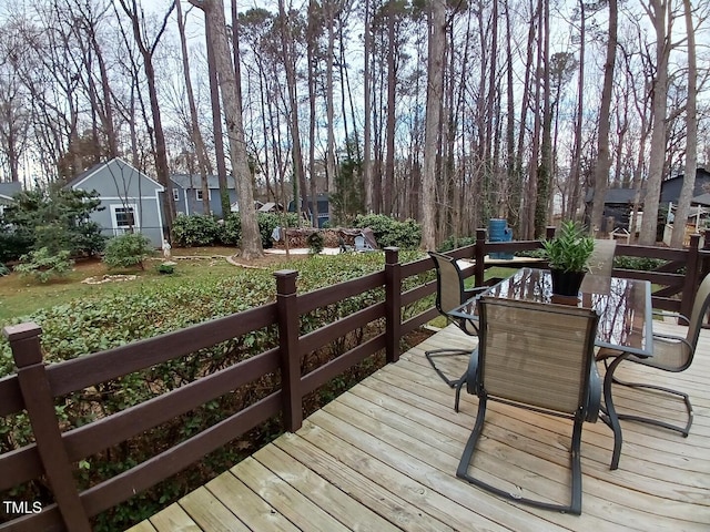 deck featuring outdoor dining area