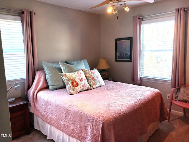 carpeted bedroom featuring ceiling fan