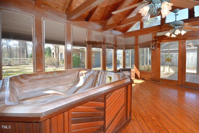 unfurnished sunroom with a jacuzzi, vaulted ceiling with beams, wooden ceiling, and ceiling fan