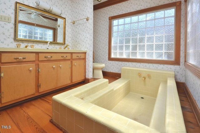 full bathroom with wallpapered walls, vanity, toilet, and wood finished floors