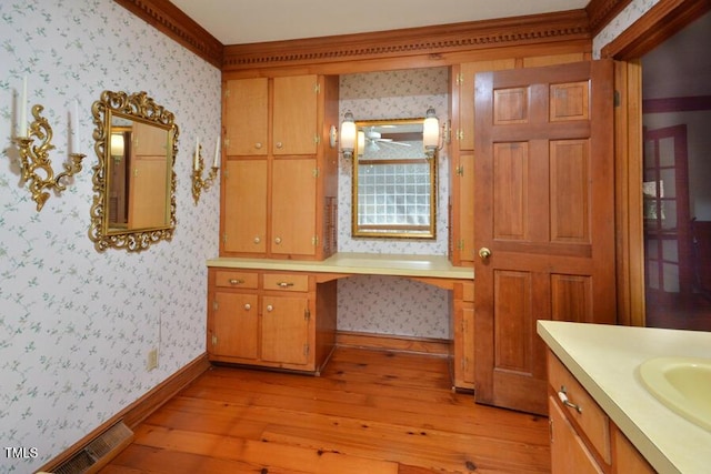 bathroom with visible vents, wallpapered walls, and hardwood / wood-style floors