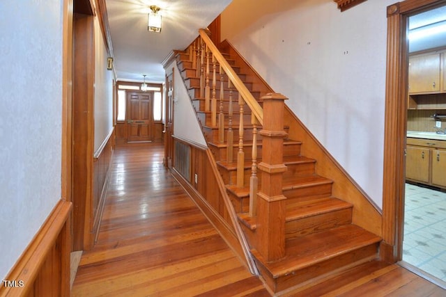 stairway featuring hardwood / wood-style flooring