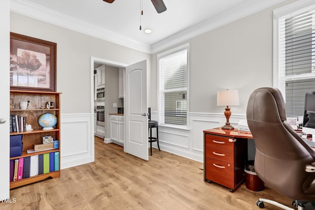 home office featuring light wood finished floors, crown molding, and ceiling fan