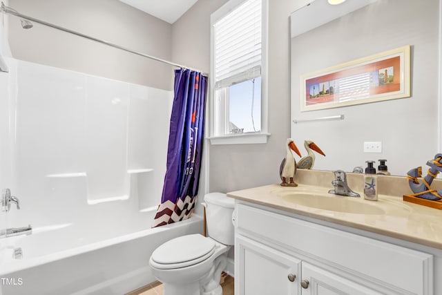 bathroom featuring toilet, vanity, and shower / tub combo