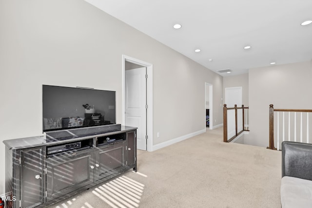 interior space with light carpet, recessed lighting, and baseboards