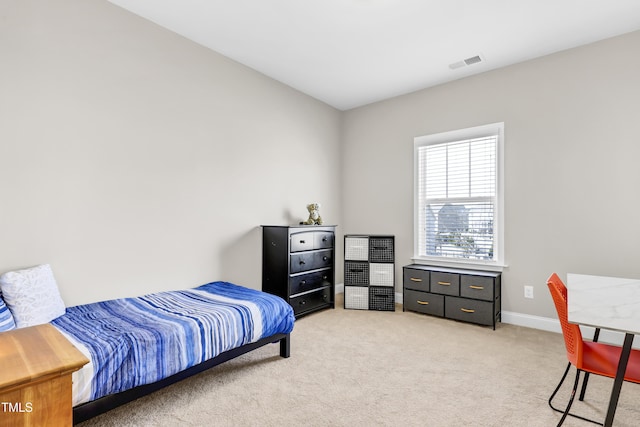 bedroom featuring light colored carpet, visible vents, and baseboards