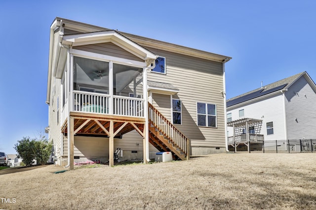 back of property featuring crawl space, stairs, and fence