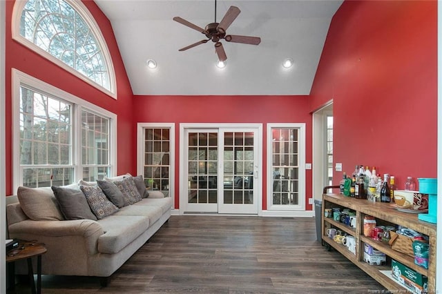 sunroom with vaulted ceiling and a ceiling fan