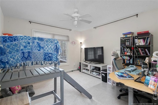 home office featuring a textured ceiling and a ceiling fan