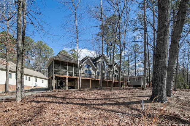 back of house featuring a sunroom