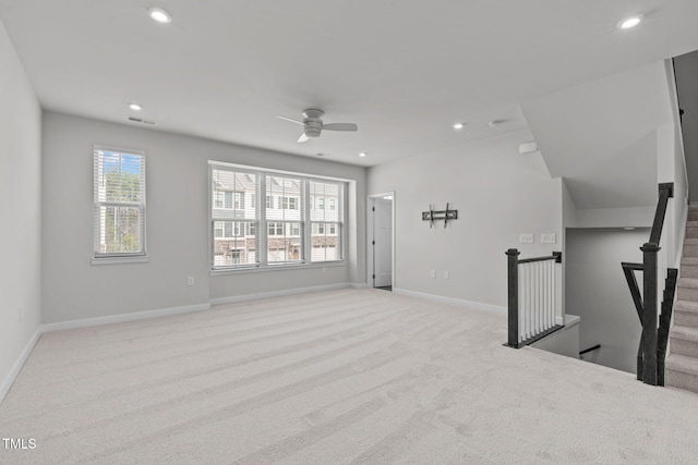 living area with a ceiling fan, baseboards, visible vents, recessed lighting, and light carpet