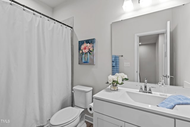 full bathroom featuring toilet and vanity