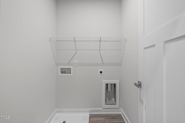 clothes washing area with electric dryer hookup, dark wood-type flooring, baseboards, hookup for a washing machine, and laundry area