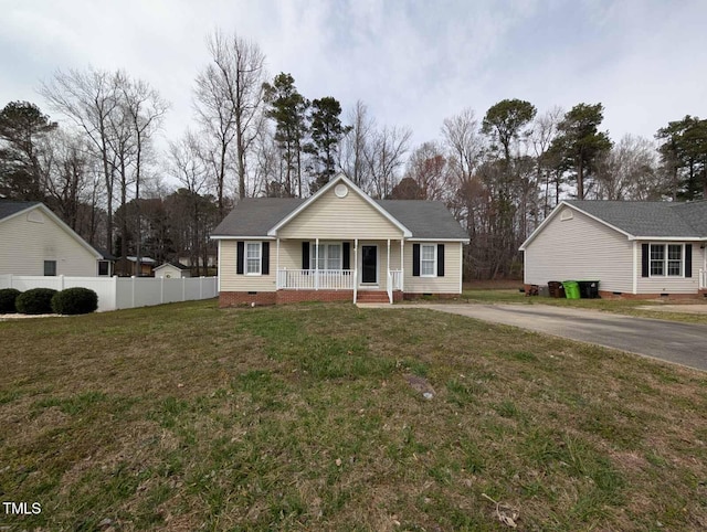 view of front of home featuring crawl space, a porch, a front yard, and fence