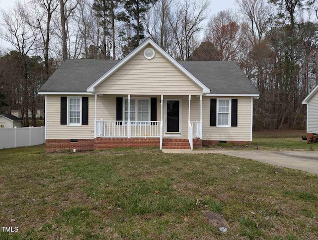 view of front of property with a front yard, fence, roof with shingles, covered porch, and crawl space