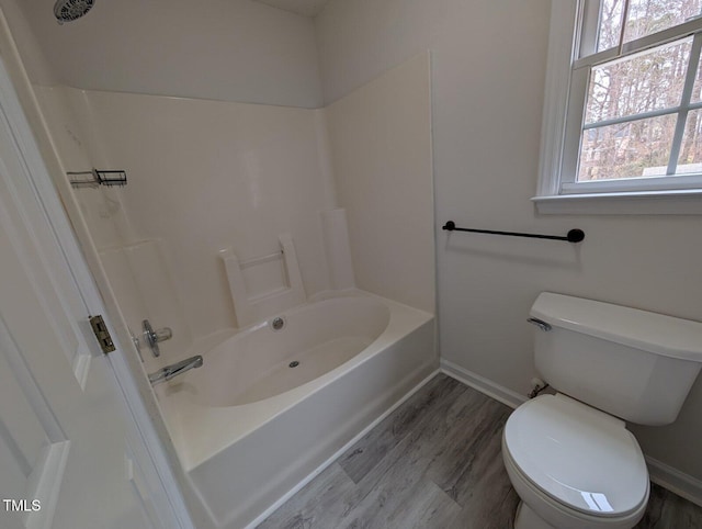 full bathroom featuring toilet, baseboards, and wood finished floors