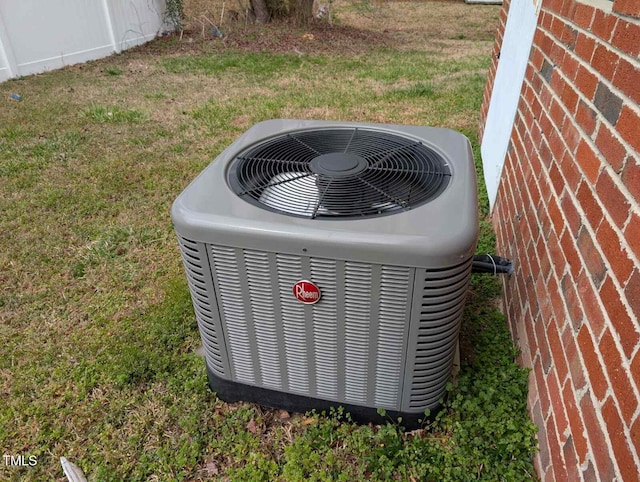 details with central air condition unit and brick siding