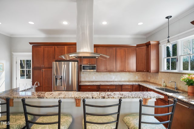 kitchen featuring backsplash, light stone countertops, a breakfast bar, appliances with stainless steel finishes, and a sink